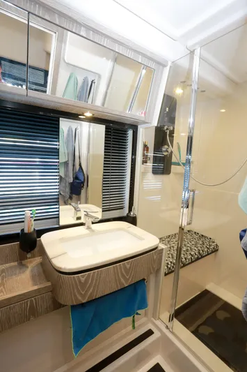  Yacht Photos Pics Bathroom interior of 2019 Azimut Magellano 53 yacht with modern sink and shower.