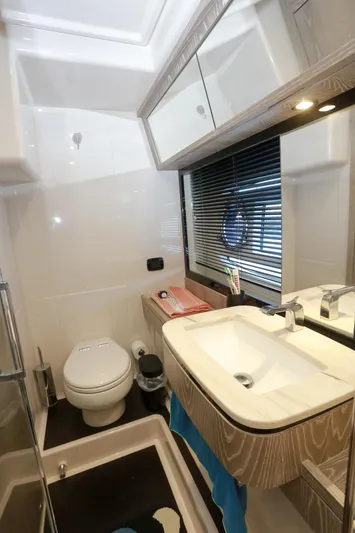  Yacht Photos Pics Bathroom interior of 2019 Azimut Magellano 53 yacht, featuring modern fixtures and sleek design.