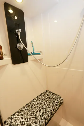  Yacht Photos Pics Shower area in 2019 Azimut Magellano 53 yacht with mosaic bench and modern fixtures.