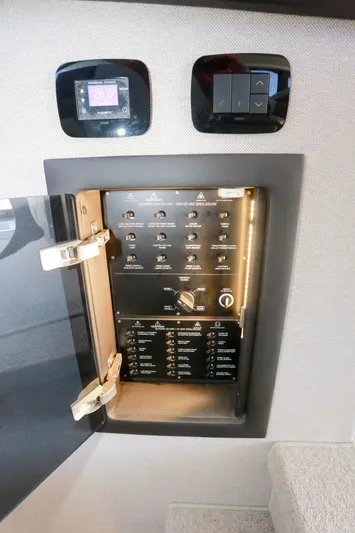  Yacht Photos Pics Control panel inside a 2019 Azimut Magellano 53 yacht, featuring switches and digital displays.