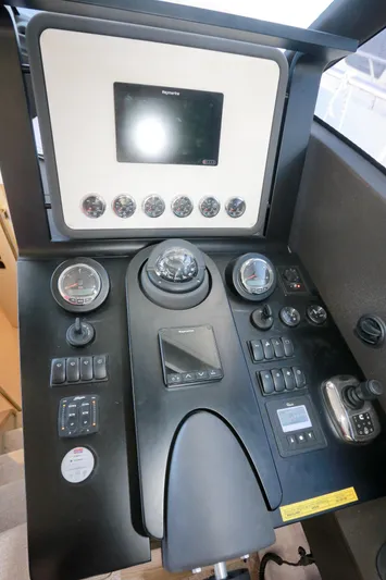  Yacht Photos Pics Control panel of 2019 Azimut Magellano 53 yacht with navigation instruments and gauges.