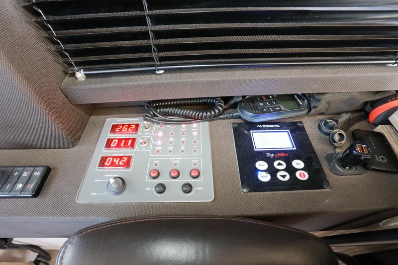  Yacht Photos Pics Control panel of a 2019 Azimut Magellano 53 yacht, featuring digital displays and switches.