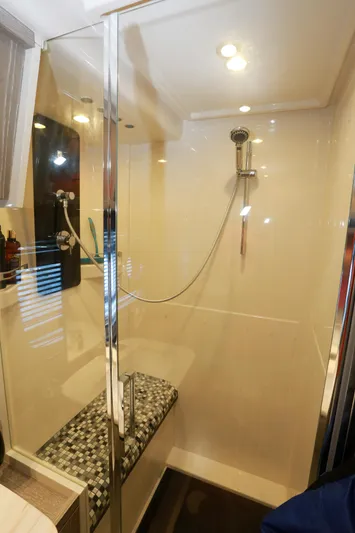  Yacht Photos Pics Luxurious shower area in 2019 Azimut Magellano 53 yacht with modern fixtures.