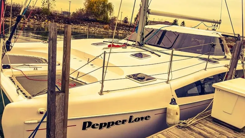 Pepper Love Yacht Photos Pics 2020 Seawind 1190 Sport catamaran Pepper Love docked at a marina.