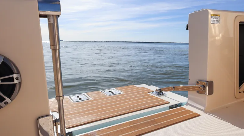  Yacht Photos Pics 2023 Grady-White 281 Coastal Explorer boat deck overlooking calm waters.