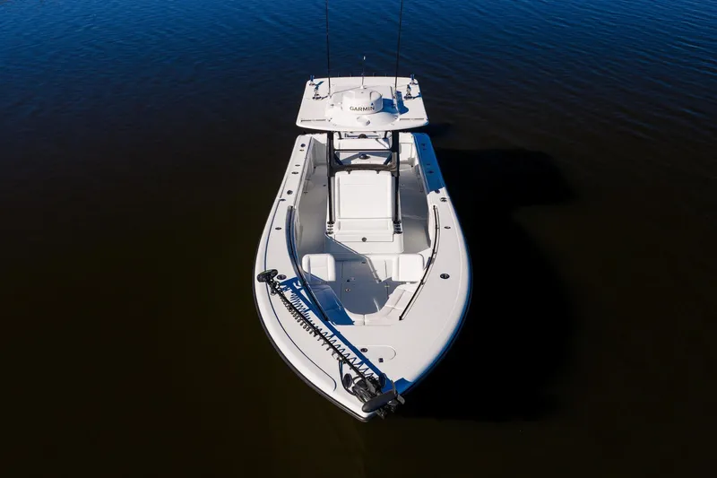  Yacht Photos Pics 2023 Yellowfin 32 Offshore boat on calm water, aerial view.