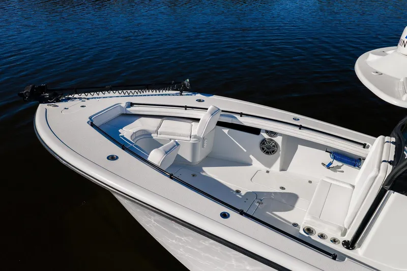  Yacht Photos Pics 2023 Yellowfin 32 Offshore boat with sleek design and spacious seating on calm water.