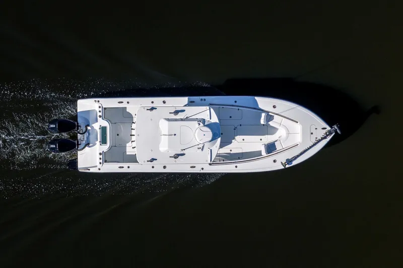  Yacht Photos Pics Aerial view of 2023 Yellowfin 32 Offshore boat cruising on dark water.
