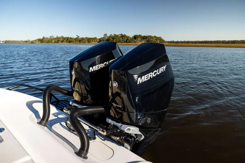  Yacht Photos Pics Twin Mercury outboard engines on a 2023 Yellowfin 32 Offshore boat, cruising on calm waters.