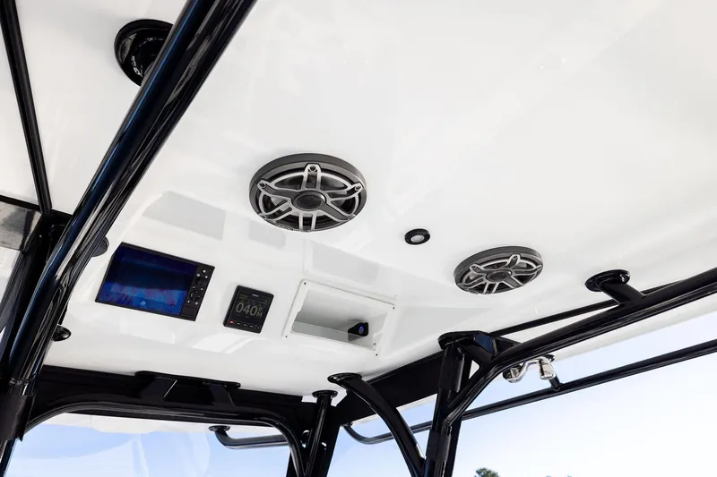  Yacht Photos Pics 2023 Yellowfin 32 Offshore boat interior with speakers and electronic displays.