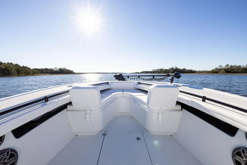  Yacht Photos Pics 2023 Yellowfin 32 Offshore boat on calm water under bright sun.