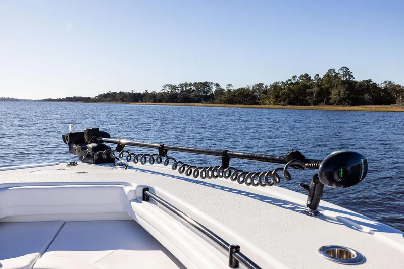  Yacht Photos Pics 2023 Yellowfin 32 Offshore boat on calm water, featuring a trolling motor.