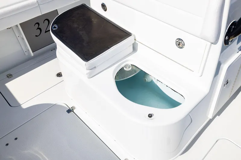  Yacht Photos Pics 2023 Yellowfin 32 Offshore boat interior with livewell and seating area.