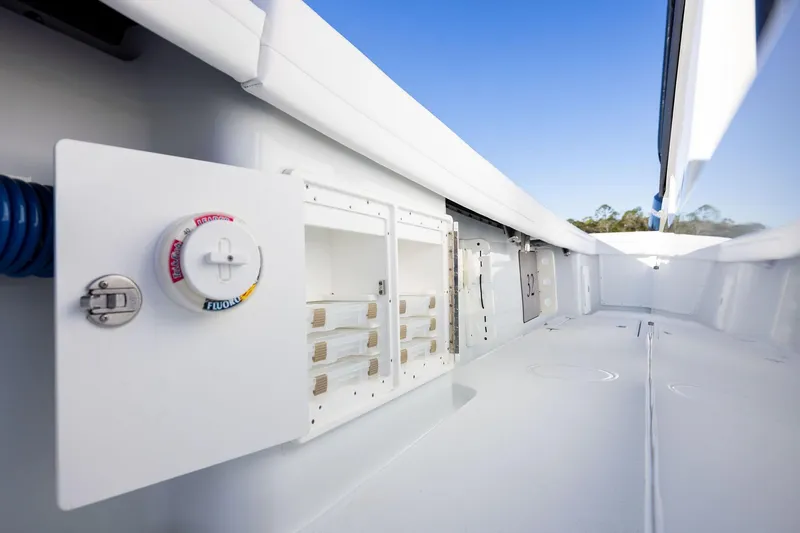  Yacht Photos Pics 2023 Yellowfin 32 Offshore boat interior with storage compartments and clean design.