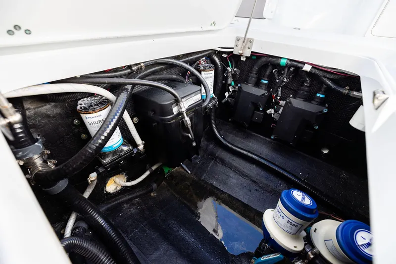  Yacht Photos Pics Engine compartment of 2023 Yellowfin 32 Offshore boat, showcasing wiring and components.
