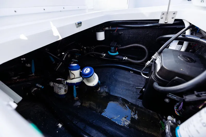  Yacht Photos Pics Engine compartment of 2023 Yellowfin 32 Offshore boat, showcasing mechanical components and wiring.