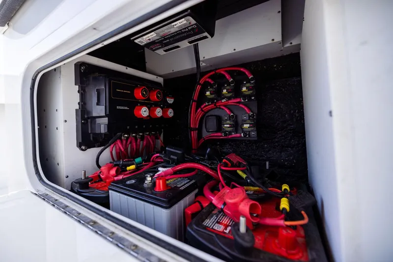  Yacht Photos Pics Electrical system of 2023 Yellowfin 32 Offshore boat, featuring batteries and wiring.