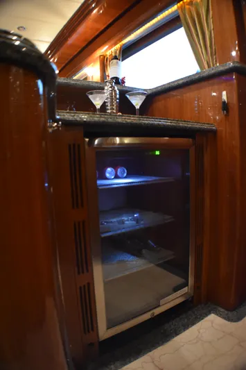 Magic Moments Yacht Photos Pics Luxurious 2006 Johnson Country Kitchen with elegant wooden cabinetry and built-in mini fridge.