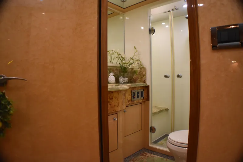 Magic Moments Yacht Photos Pics Luxurious bathroom in 2006 Johnson Country Kitchen yacht, featuring elegant marble and modern fixtures.