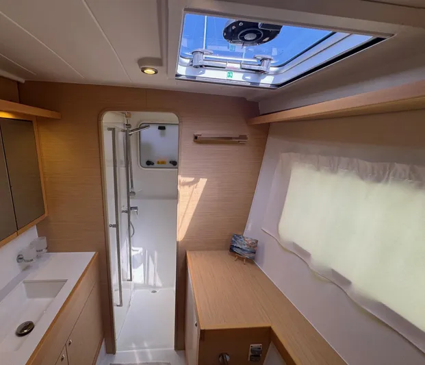 Serenity Yacht Photos Pics Interior of 2016 Lagoon 400 S2 yacht bathroom with shower and skylight.