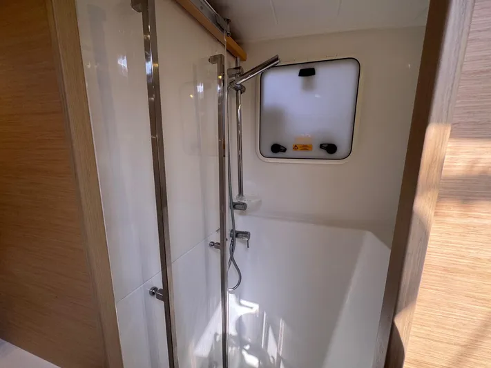 Serenity Yacht Photos Pics Shower area in 2016 Lagoon 400 S2 yacht, featuring modern fixtures and natural lighting.