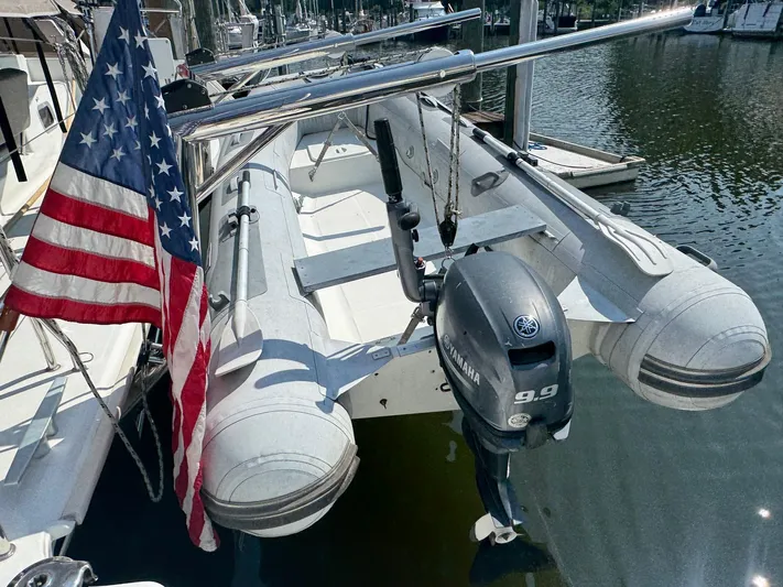 Serenity Yacht Photos Pics Inflatable boat with Yamaha motor on Lagoon 400 S2, 2016, docked with American flag.