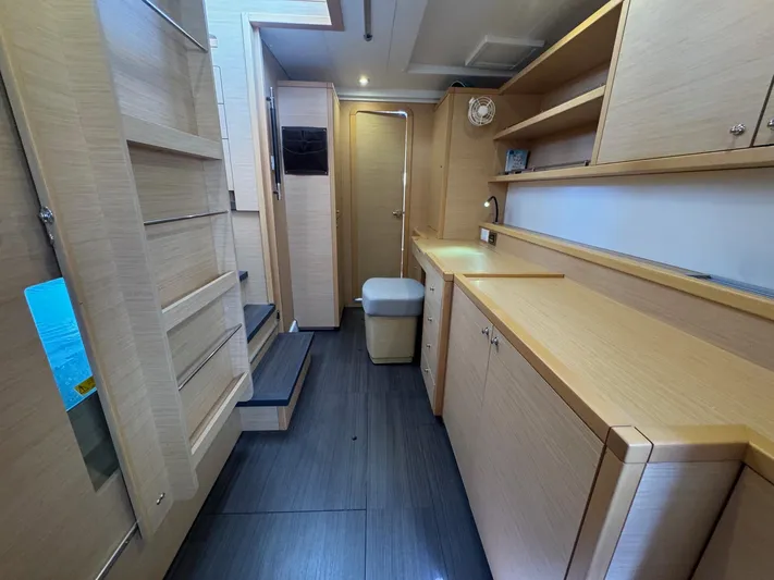 Serenity Yacht Photos Pics Interior of 2016 Lagoon 400 S2 yacht with modern wood cabinetry and sleek design.