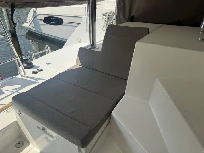 Serenity Yacht Photos Pics 2016 Lagoon 400 S2 yacht with cushioned seating area on deck.
