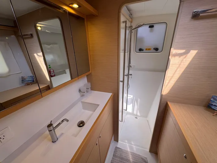 Serenity Yacht Photos Pics Modern bathroom interior of 2016 Lagoon 400 S2 yacht with sleek design and ample lighting.