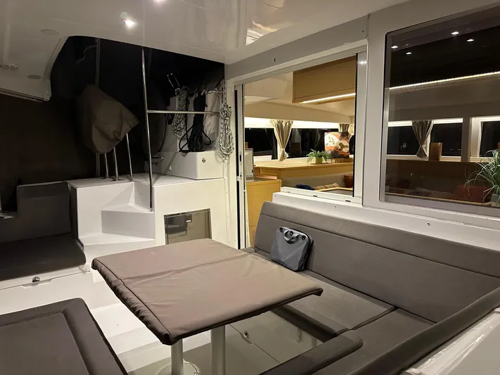 Serenity Yacht Photos Pics Interior of 2016 Lagoon 400 S2 catamaran with modern seating and dining area.