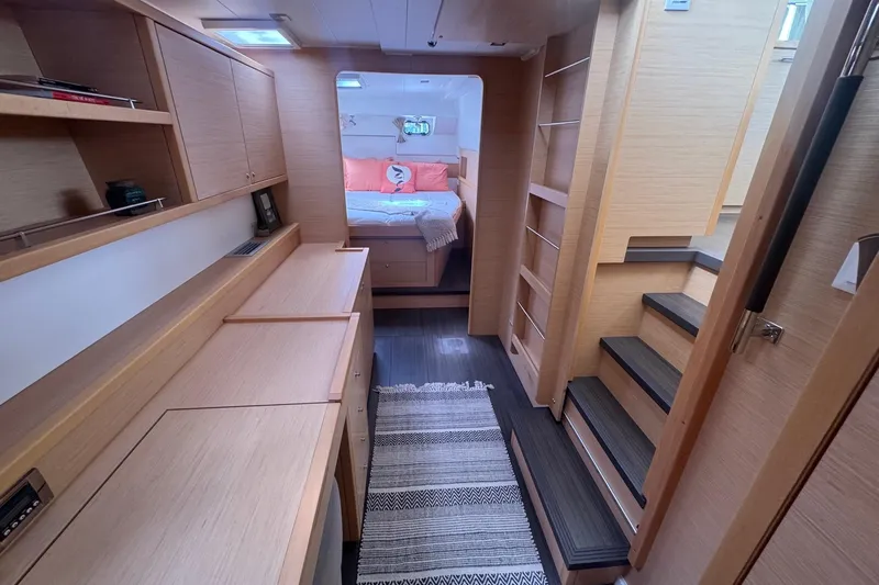 Serenity Yacht Photos Pics Interior of 2016 Lagoon 400 S2 yacht with modern wood finish and cozy bedroom.