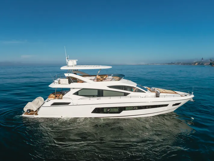 Agua Rancho Yacht Photos Pics 2017 Sunseeker 75 Yacht cruising on calm blue waters under clear skies.