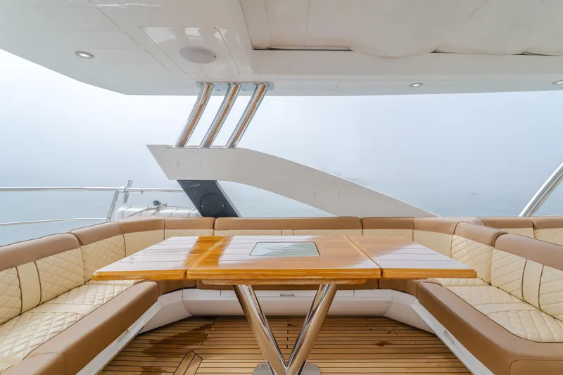 Agua Rancho Yacht Photos Pics Luxurious seating area on 2017 Sunseeker 75 Yacht with elegant wood table.
