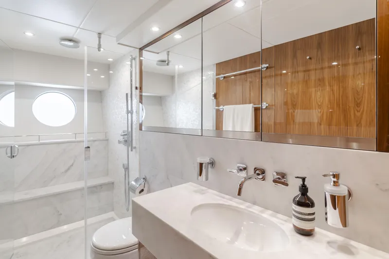 Agua Rancho Yacht Photos Pics Luxurious bathroom interior of 2017 Sunseeker 75 Yacht with modern fixtures and elegant design.