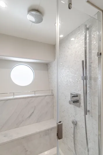 Agua Rancho Yacht Photos Pics Luxurious bathroom in 2017 Sunseeker 75 Yacht with modern shower and elegant marble design.