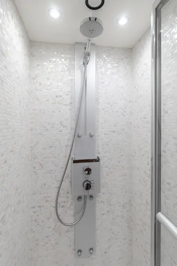 Agua Rancho Yacht Photos Pics Luxurious shower in 2017 Sunseeker 75 Yacht with modern fixtures and elegant white tiling.