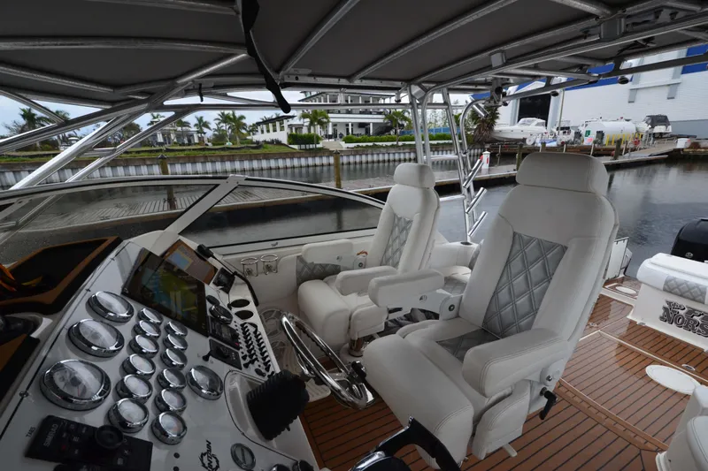Flying Norseman II Yacht Photos Pics 2007 Fountain 38 Sportfish Cruiser OB cockpit with luxurious seating and advanced controls.