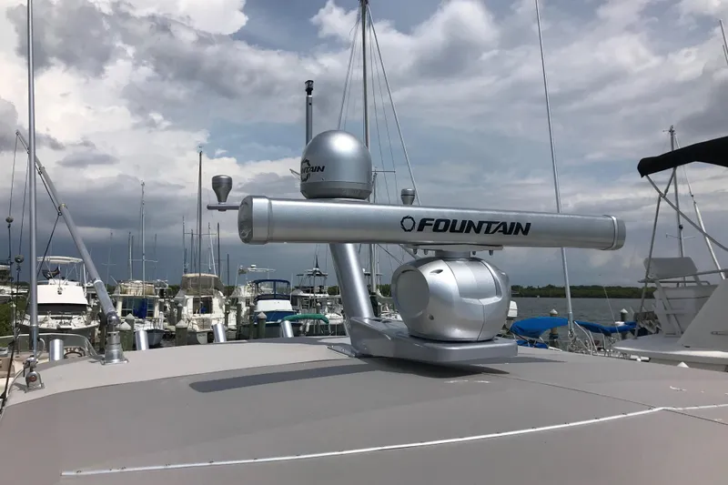Flying Norseman II Yacht Photos Pics 2007 Fountain 38 Sportfish Cruiser OB radar system on a cloudy marina day.