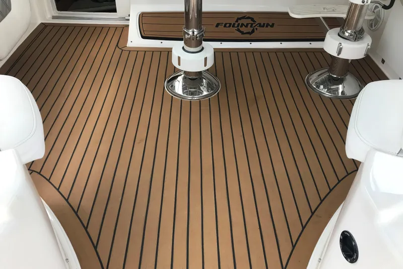 Flying Norseman II Yacht Photos Pics 2007 Fountain 38 Sportfish Cruiser OB interior with teak-style flooring and chrome fixtures.