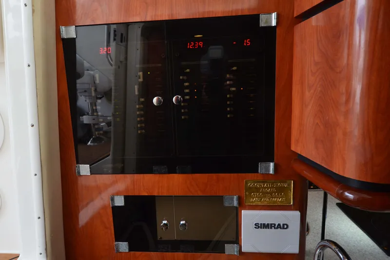 Flying Norseman II Yacht Photos Pics Control panel of 2007 Fountain 38 Sportfish Cruiser OB with Simrad electronics.