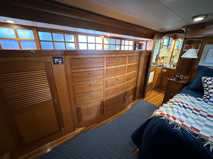 Miss Stephanie Yacht Photos Pics Luxurious wooden interior of a 2008 Marlow 70 Explorer yacht bedroom.