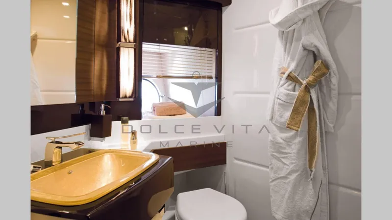  Yacht Photos Pics Luxurious bathroom interior of 2011 Azimut 72S yacht with elegant fixtures and robe.
