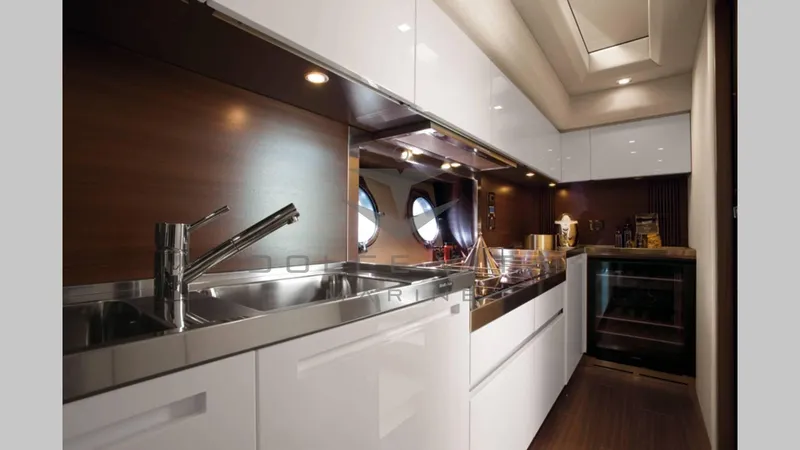  Yacht Photos Pics Luxurious kitchen interior of 2011 Azimut 72S yacht with modern fixtures and sleek design.