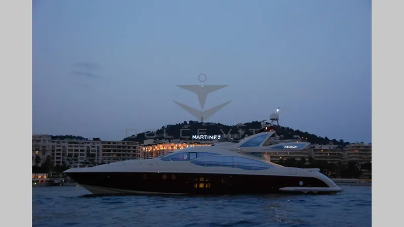  Yacht Photos Pics 2011 Azimut 72S yacht on calm waters at dusk, cityscape in background.