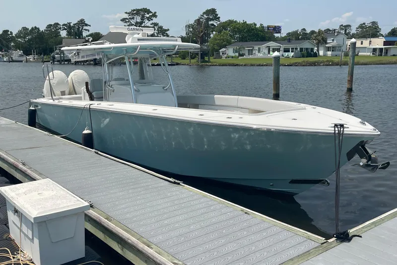  Yacht Photos Pics 2020 Jupiter 38 boat docked on a sunny day, featuring sleek design and modern equipment.