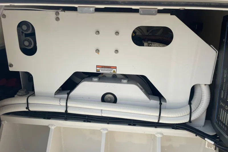  Yacht Photos Pics SeaKeeper compartment of a 2020 Jupiter 38 boat, showcasing mechanical components and wiring.