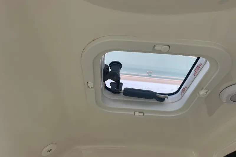  Yacht Photos Pics Boat hatch interior of 2020 Jupiter 38, showcasing window latch mechanism.