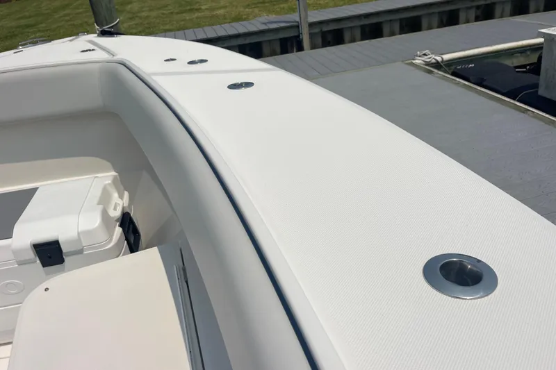  Yacht Photos Pics 2020 Jupiter 38 boat deck with rod holders and storage compartment.