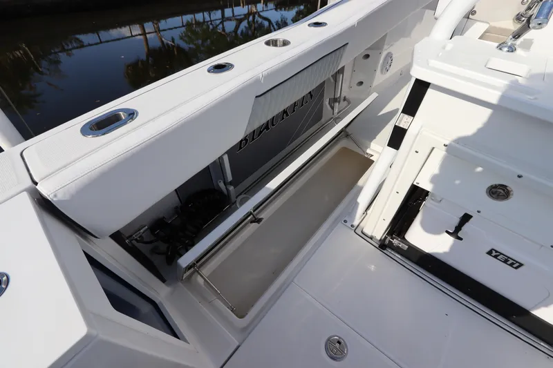  Yacht Photos Pics 2023 Blackfin 272 CC boat interior with storage compartment and sleek design.