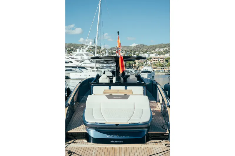  Yacht Photos Pics 2023 Solaris Power 44 Open yacht docked in a sunny marina.